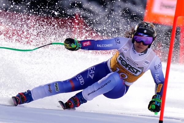 Italy's Federica Brignone speeds down the course of an alpine ski, women's World Cup super G race, in La Thuile, Italy, Thursday, March 13, 2025. (AP Photo/Piermarco Tacca)