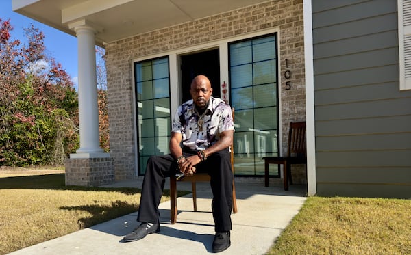 Jeremiah Canty sits outside his residence at one of the "tiny cottages" in Macon that were recently built for people who have been homeless and have a mental health or substance-use disorder. (Joe Kovac Jr./AJC)