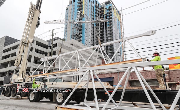 Spring Street is blocked due to the removal of a giant crane. JOHN SPINK / JSPINK@AJC.COM