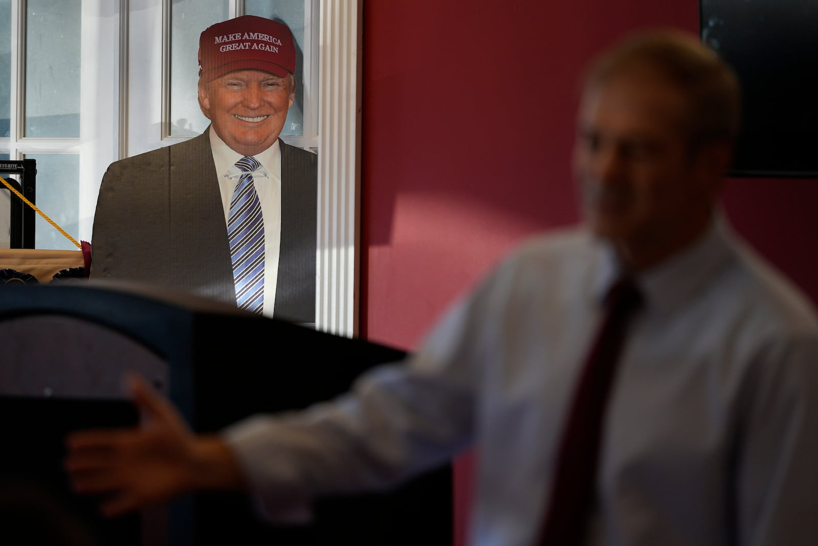 A cardboard cutout of Republican presidential nominee former President Donald Trump is seen as Rep. Jim Jordan, R-Ohio, speaks at a rally for Rep. Michael Rulli, R-Ohio, at the Mahoning County Republican Party headquarters in Boardman, Ohio, Thursday, Oct. 17, 2024. (AP Photo/Carolyn Kaster)