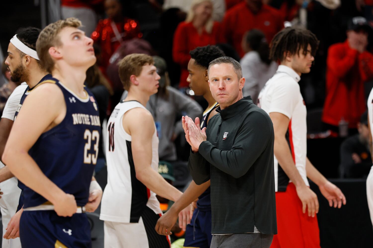 Bulldogs coach Mike White applauds after his team defeated the Fighting Irish 77-62 on Sunday night at State Farm Arena. (Miguel Martinez / miguel.martinezjimenez@ajc.com)