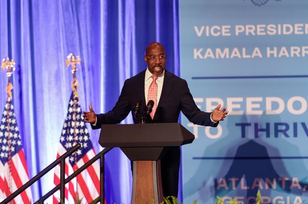 U.S. Sen. Raphael Warnock, D-Ga., speaks Monday during an event at the Georgia International Convention Center to kick off Vice President Kamala Harris' economic tour focusing on improving opportunities for Black men. (Natrice Miller/ AJC)