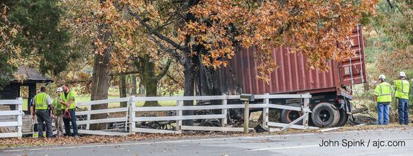 Flames from a tractor-trailer crash spread to a home in Bartow County, authorities said. JOHN SPINK / JSPINK@AJC.COM