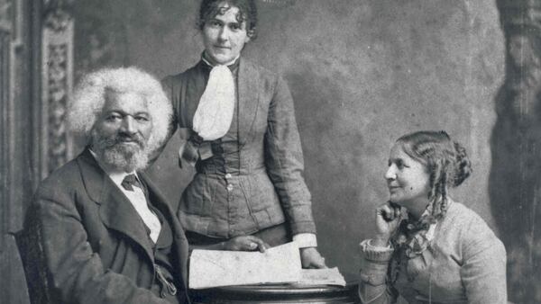 Frederick Douglass poses with Helen Pitts Douglass (seated, right). Helen's sister Eva Pitts stands in the center. (National Parks Service)