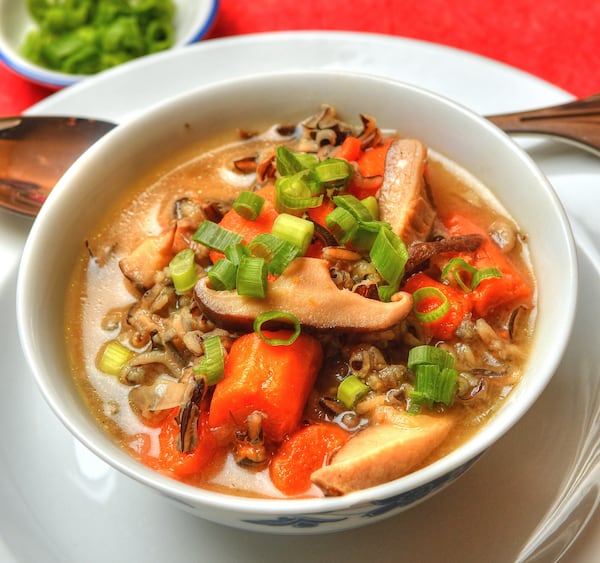 Shiitake Mushroom, Wild Rice, Ginger and Miso Soup, garnished with green onions. (Styling by Jennifer Zyman / photo by Chris Hunt for the AJC)