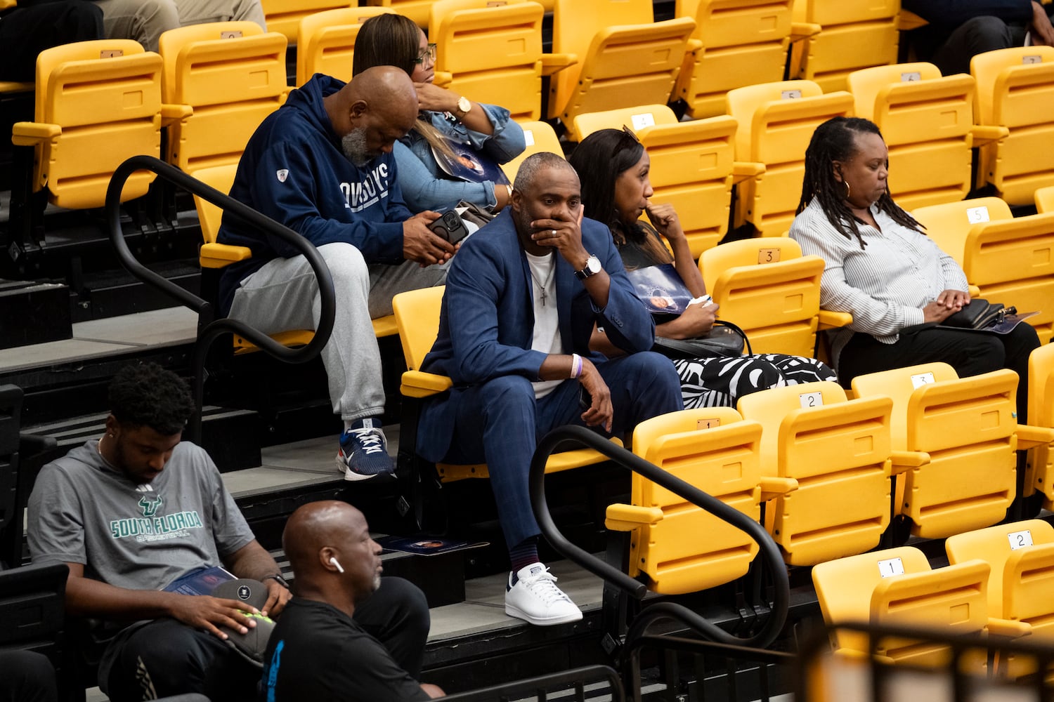 People listen to a prayer at the opening of a celebration of life for former Kennesaw State University basketball coach Amir Abdur-Rahim at the KSU convocation center on Sunday, Oct. 27, 2024.   Ben Gray for the Atlanta Journal-Constitution