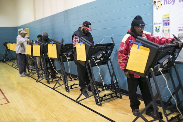 People vote Nov. 8, 2016, at the Linden Recreation Center in Columbus, Ohio. The Supreme Court on Monday upheld Ohio’s efforts to purge its voting rolls. The court ruled that a state may kick people off the rolls if they skip a few elections and fail to respond to a notice from state election officials. (Maddie McGarvey/The New York Times)