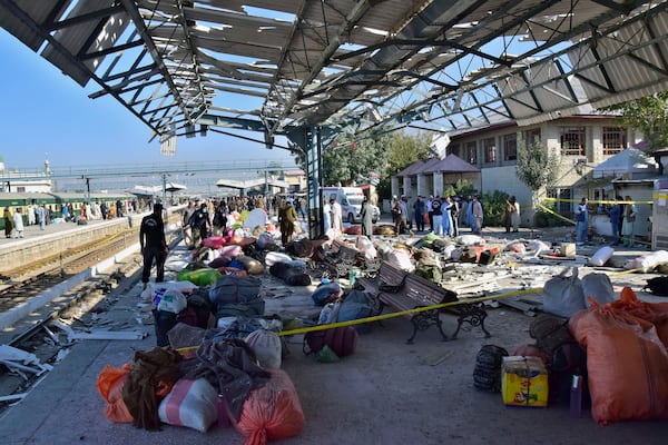 Security officials examine the site of a bomb explosion at railway station in Quetta, southwestern Pakistan, Saturday, Nov. 9, 2024. (AP Photo/Arshad Butt)