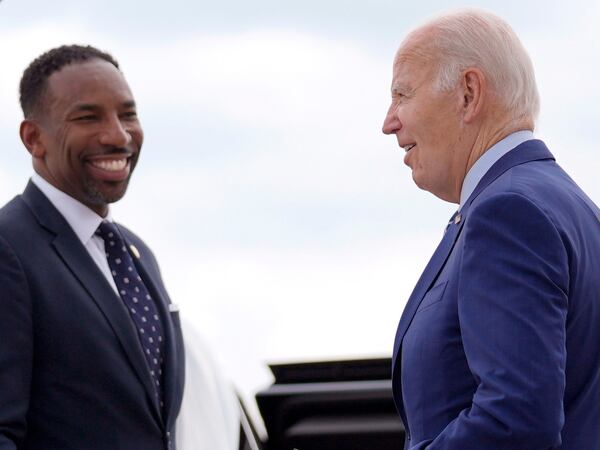 Atlanta Mayor Andre Dickens (left) continues to voice support for  President Joe Biden (right).