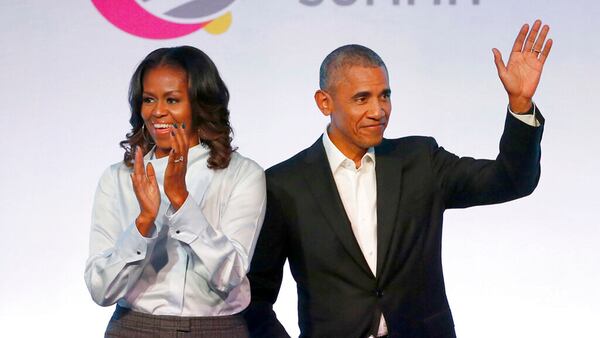 In this Oct. 31, 2017, file photo, former President Barack Obama, right, and former first lady Michelle Obama appear at the Obama Foundation Summit in Chicago.  The Obamas have unveiled a slate of projects in development for Netflix, a year after the former president and first lady signed a deal with the streaming platform. The Obamas' production company, Higher Ground Productions, announced on April 30, 2019 that a total of seven films and series that Barack Obama said will entertain, educate, connect and inspire.