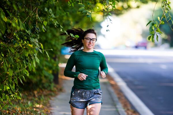 Jenna Hamlin, who has cystic fibrosis, says that within days of starting the new Trikafta drug treatment, she felt good enough to go for a run, something she hadn’t been able to do for more than a year. She says that she laughed the whole way. “It was just pure joy," she says. "I was passing people who probably thought, ‘Who is this weirdo?’” (Christina Matacotta / For The Atlanta Journal-Constitution)