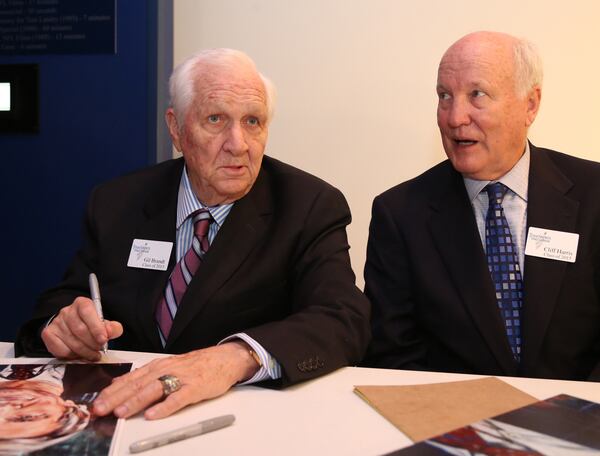  Gil Brandt, left, former Dallas Cowboys vice president of player personnel, signs autographs with former Cowboys defensive back Cliff Harris during the 2015 Texas Sports Hall of Fame induction class news conference, Thursday, April 9, 2015, in Waco, Texas. (AP Photo/Waco Tribune Herald, Rod Aydelotte)