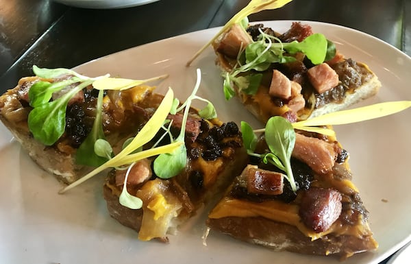 Among shareable plates at Citizen Soul, try the kabocha squash toast, which features the pureed squash topped with braised bacon, caramelized onions and currants. LIGAYA FIGUERAS / LFIGUERAS@AJC.COM