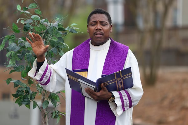 Father Urey Patrick Mark leads a prayer vigil for Jatonne Sterling at the parking lot of the Lyke House, the Catholic campus ministry at Atlanta University Center, on Wednesday, March 1, 2023, in Atlanta. Jatonne Sterling, a Clark Atlanta student, was fatally shot at the center’s parking lot, on Beckwith Street the day before, Tuesday afternoon, Feb. 28, 2023. Jason Getz / Jason.Getz@ajc.com)
