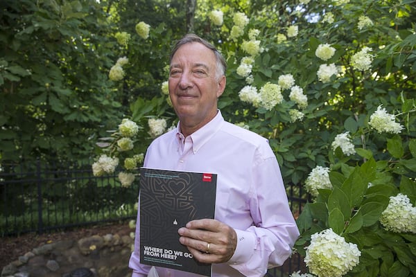 Author Jack Alexander holds a copy of his latest book, “Where Do We Go From Here?,” a montage of perspectives from U.S. Christians on their views about racism. ALYSSA POINTER / ALYSSA.POINTER@AJC.COM