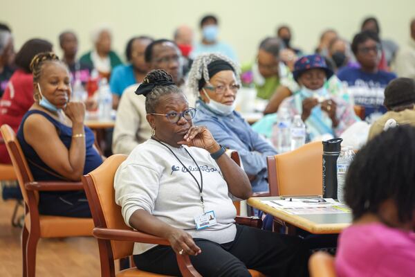 Senior citizens in DeKalb County listen during a presentation about scams Thursday.