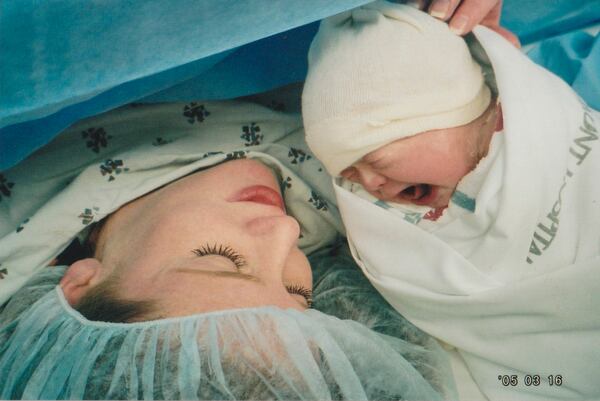 Betsy Glass holds daughter Darden after her birth in 2005. (Contributed)