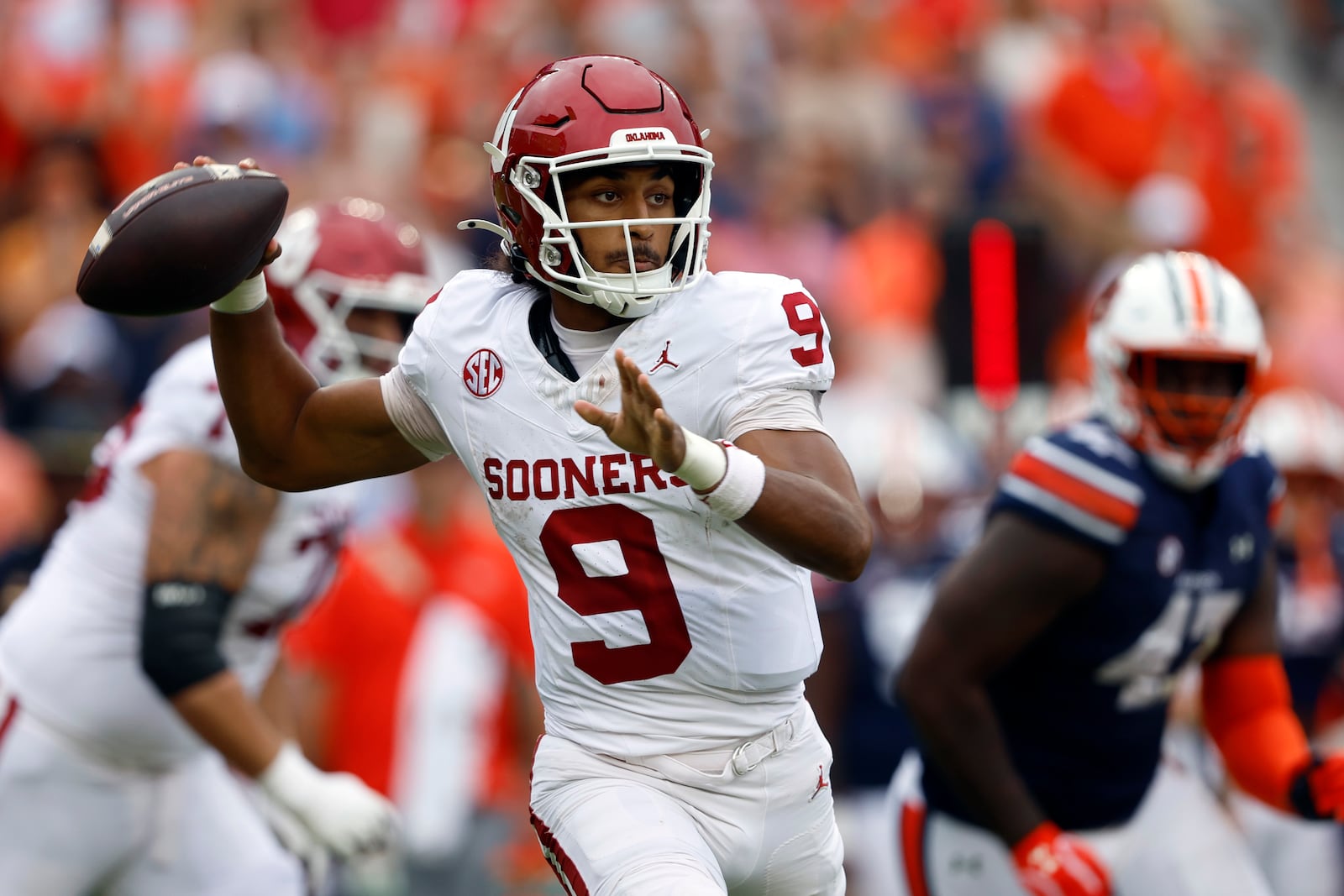 Oklahoma quarterback Michael Hawkins Jr. (9) throws a pass during the first half of an NCAA college football game against Auburn, Saturday, Sept. 28, 2024, in Auburn, Ala. (AP Photo/Butch Dill)