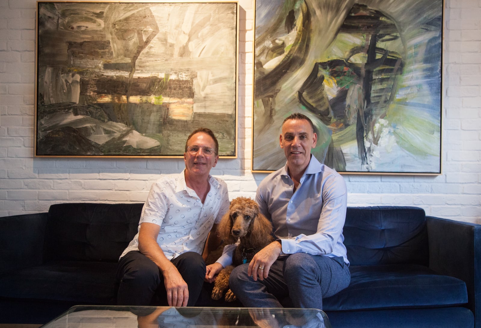 Mark (left) and Dave Curran, with their dog, Chelsea, purchased the 1,610-square-foot brick townhome in Castleberry Hill in 2003. Mark manages commercial real estate and Dave sells software to colleges.