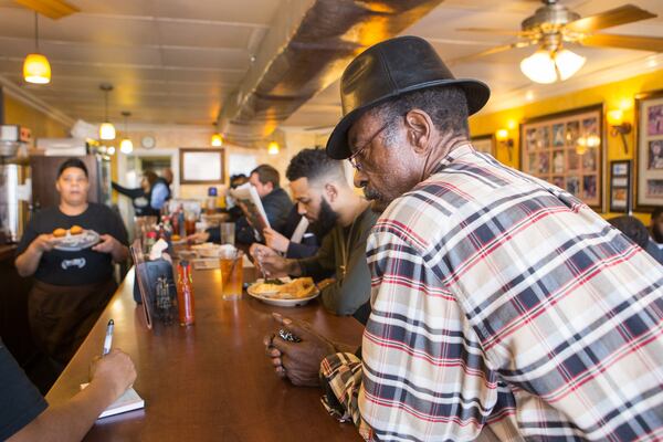 Johnny Scott, a regular at The Busy Bee Cafe, orders a Ox Tails to go at the restaurnt on Martin Luther King Jr. Dr. NE.  The historic soul food restaurant opened in 1947.   (Jenni Girtman/ Atlanta Event Photography)