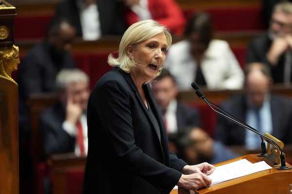 French far-right leader Marine Le Pen delivers her speech at the National Assembly prior to a no-confidence vote that could bring down the Prime Minister and the government for the first time since 1962, Wednesday, Dec. 4, 2024 in Paris. (AP Photo/Michel Euler)