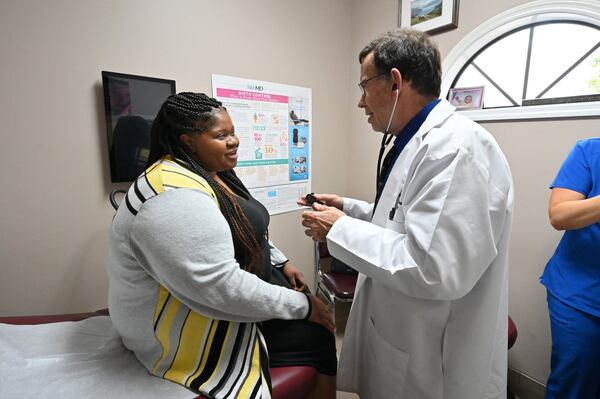 Dr. Jeffrey Harris checks his patient Harriette Doomes at Wayne Obstetrics and Gynecology in Jesup, Ga., on Feb. 6, 2020. Doomes, 39, is considered at higher risk for maternal mortality because of her age, weight and high blood pressure. (Hyosub Shin / Hyosub.Shin@ajc.com)