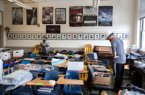 Newnan High School teacher Frankey Henderson looks over teaching materials that still need to be boxed up in one of the classrooms on Saturday, April  17, 2021. (Photo: Steve Schaefer for The Atlanta Journal-Constitution)