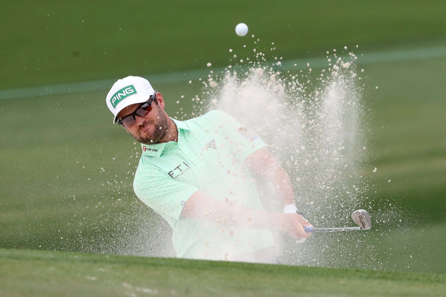 April 10, 2021, Augusta: Corey Conners hits out of the bunker on the second hole during the third round of the Masters at Augusta National Golf Club on Saturday, April 10, 2021, in Augusta. Curtis Compton/ccompton@ajc.com