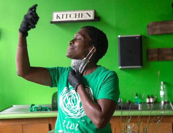 Owner of Iwi Fresh Farm-to-Skin Spa Yolanda Owens tries her freshly made hydration face mist at her Atlanta spa Wednesday, July 01, 2020. STEVE SCHAEFER FOR THE ATLANTA JOURNAL-CONSTITUTION