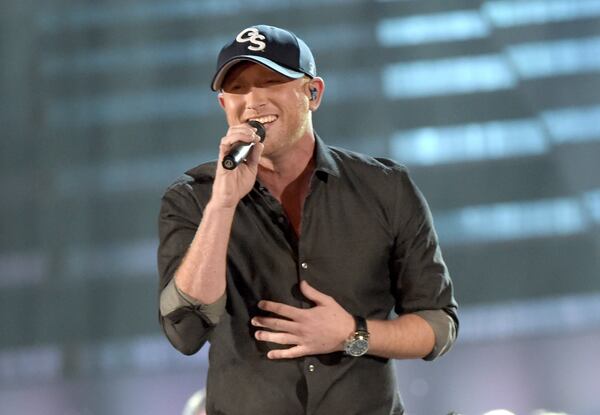 NASHVILLE, TN - NOVEMBER 05: Cole Swindell performs during the 48th annual CMA Awards at the Bridgestone Arena on November 5, 2014 in Nashville, Tennessee. (Photo by Rick Diamond/Getty Images) Cole Swindell.