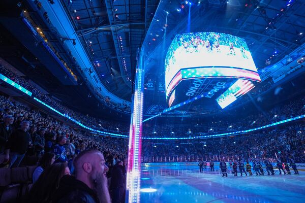 Fans boo as the United States national anthem is sung before the Vancouver Canucks and Detroit Red Wings play an NHL hockey game in Vancouver, British Columbia, Sunday, Feb. 2, 2025. (Darryl Dyck/The Canadian Press via AP)