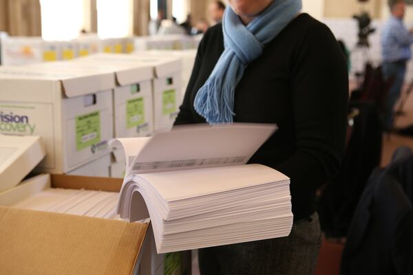 February 9, 2017, Atlanta, Georgia - A reporter reviews a portion of the more than 1.4 millions documents released in February 2017 in the Atlanta City Hall corruption investigation. (HENRY TAYLOR / HENRY.TAYLOR@AJC.COM)