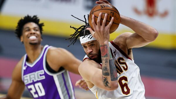 Cleveland Cavaliers' JaVale McGee (6) grabs a rebound next to Sacramento Kings' Hassan Whiteside (20) during the second half of an NBA basketball game Monday, March 22, 2021, in Cleveland. The Kings won 119-105. (AP Photo/Ron Schwane)