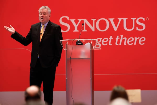 Roger Tutterow, Kennesaw State professor of economics, addresses his remarks during the annual Synovus Economic Forecast Breakfast event for insights into the economic environment at Cobb Energy Performing Arts Center on  Feb. 26. (Miguel Martinez/AJC)