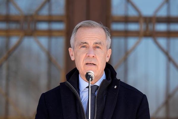 Prime Minister Mark Carney speaks to media at Rideau Hall, where he asked the Governor General to dissolve Parliament and call an election, in Ottawa, Sunday, March 23, 2025. THE CANADIAN PRESS/Adrian Wyld/The Canadian Press via AP) /The Canadian Press via AP)