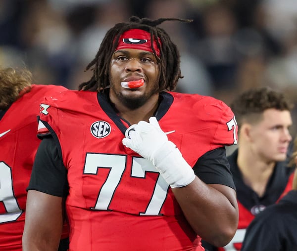 Georgia offensive lineman Earnest Greene III wore No. 77 on Nov. 25, 2023, at Georgia Tech to honor the late Devin Willock. Jason Getz/AJC 2023