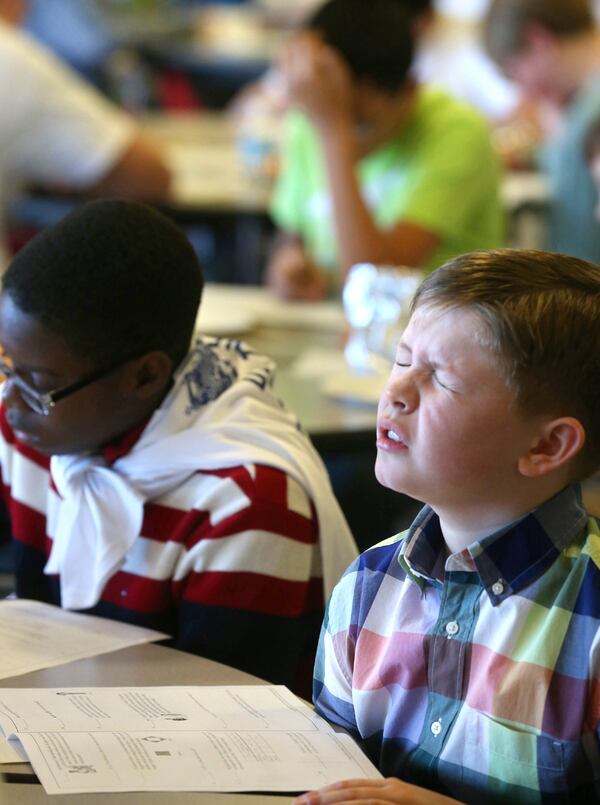 A new study suggests kids may do better solving math on their own with a lot of teacher feedback. (AP Photo/The Winchester Star, Jeff Taylor)