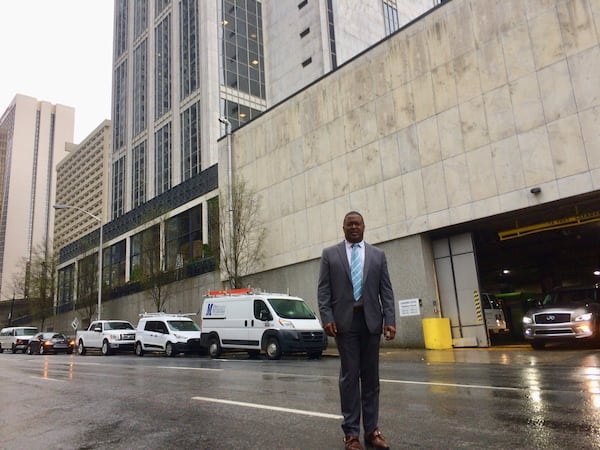 Matthew Peterson, standing in the middle of Baker Street during a late-morning lull, is the face of the opposition to converting that downtown Atlanta road into a two-way. Photo by Bill Torpy