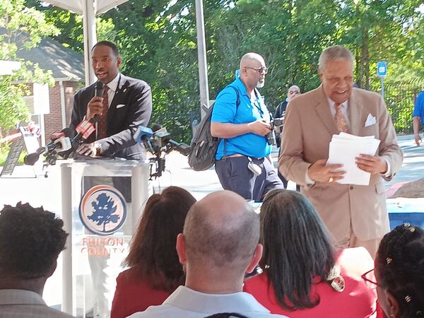 Atlanta Mayor Andre Dickens speaks Aug. 8, 2024, as Fulton County Commission Chair Robb Pitts goes to sit down after speaking. They and others celebrated the opening of the new public behavioral health crisis center in the Oak Hill Child, Family & Adolescent Center at 2805 Metropolitan Parkway SW.