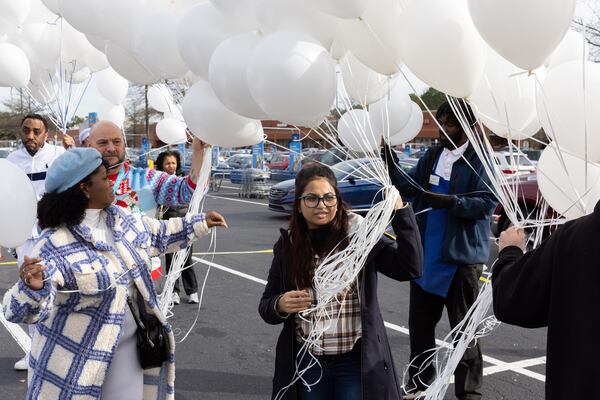 Friends, relatives and colleagues released balloons Wednesday during the event.