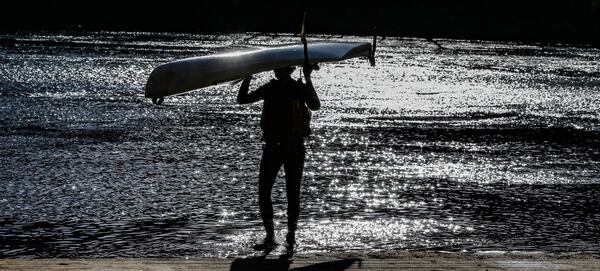 Kristofer Wollein Waldetoff emerged from the Chattahoochee River at Palisades West in Cobb County as temperatures approached record highs on Friday. JOHN SPINK / JSPINK@AJC.COM