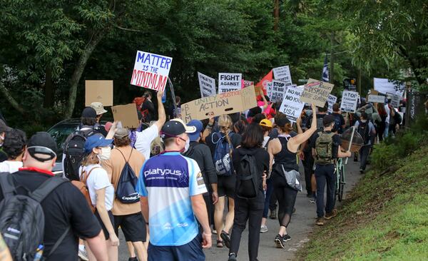 8/15/20 - Stone Mountain, GA -  Counter protestors march through the town of Stone Mountain.  Several far-right groups, including militias and white supremacists, rally Saturday in the town of Stone Mountain, and a broad coalition of leftist anti-racist groups organized a counter-demonstration there after local authorities closed Stone Mountain park.   Jenni Girtman for the Atlanta Journal Constitution