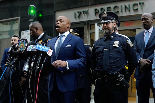 This image provided by Office of the New York Mayor shows New York Mayor Eric Adams, left center, as he briefs the media on a series of incidents that took place within the confines of the 10th and 17th Police Precincts, Monday, Nov. 18, 2024. (Mayoral Photography Office/Michael Appleton via AP)