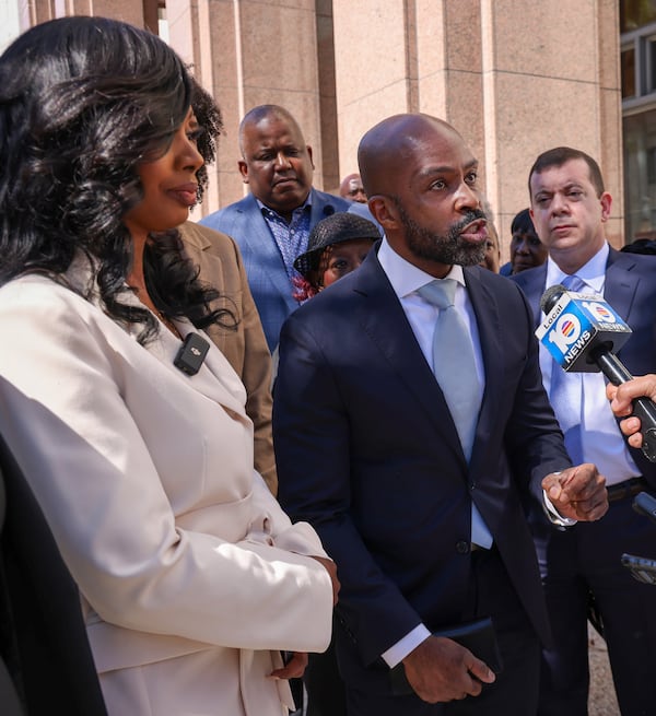 Attorney Alphonso David (center) gives a statement as Fearless Fund CEO and co-founder Arian Simone (left) and others participate in a news conference after appearing in federal court at the James Lawrence King Federal Justice Building in Miami on Wednesday, January 31, 2024. (Carl Juste/Miami Herald)