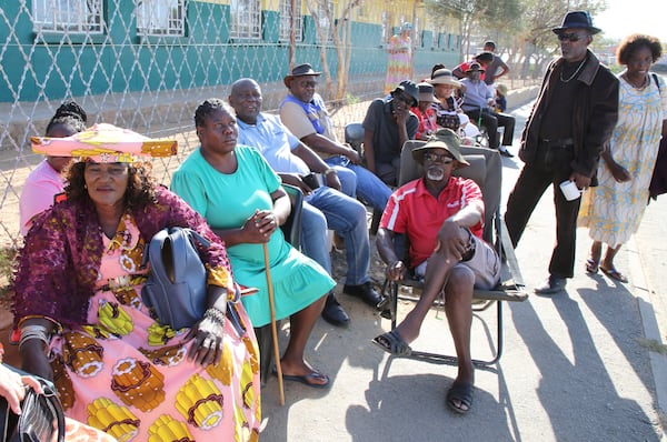 Namibians queue to cast their votes in a presidential election in Windhoek, Namibia Wednesday, Nov. 27, 2024. (AP Photo/Dirk Heinrich)