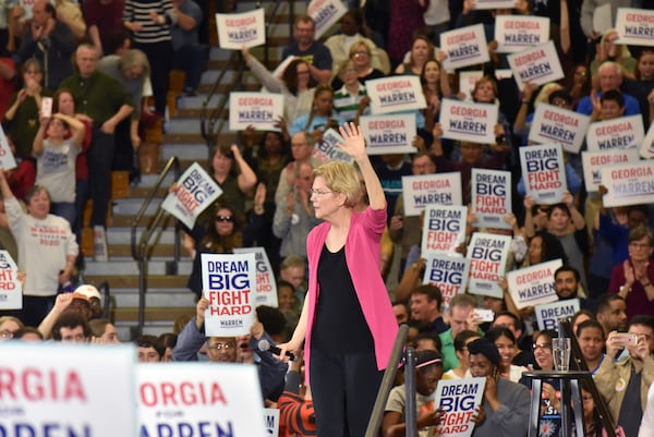 U.S. Sen. Elizabeth Warren of Massachusetts waves to supporters during a rally at Central Gwinnett High School, becoming the first Democrat to hold a campaign event in Georgia this year after launching a presidential bid. Gwinnett Democrats are touting the county, with its diverse population, as the future of the party and a destination for its presidential candidates. HYOSUB SHIN / HSHIN@AJC.COM