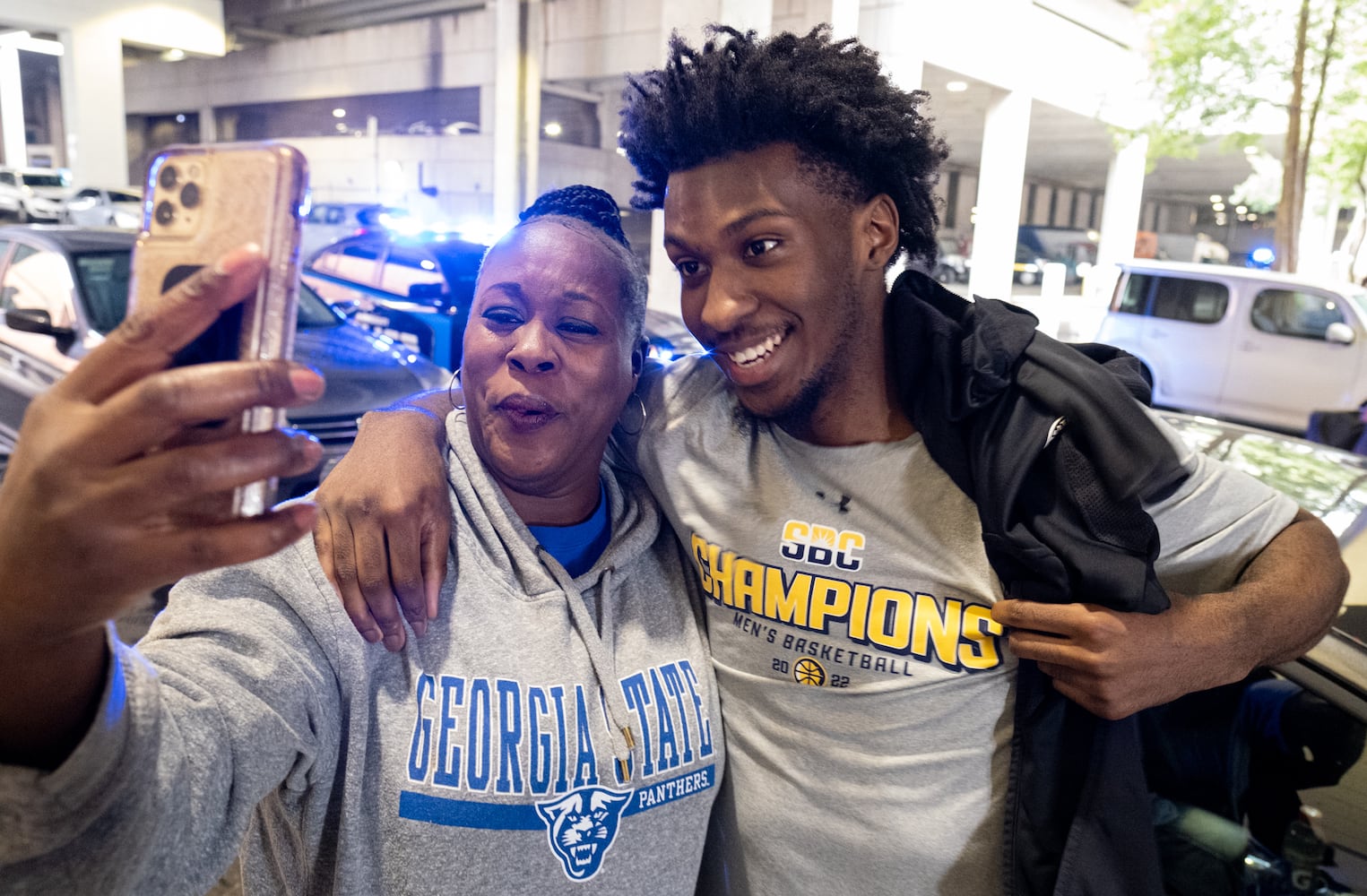 220308-Atlanta-Tina Clyce celebrates with her son Jamall after the Georgia State University basketball team returned home Tuesday, March 8, 2022, after the team won the Sun Belt Conference championship. Ben Gray for The Atlanta Journal-Constitution