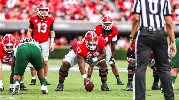 Georgia center Sedrick Van Pran (63) readies to snap the ball to quarterback Stetson Bennett (13) against UAB Saturday, Sept. 11, 2021, at Sanford Stadium in Athens. (Tony Walsh/UGA)