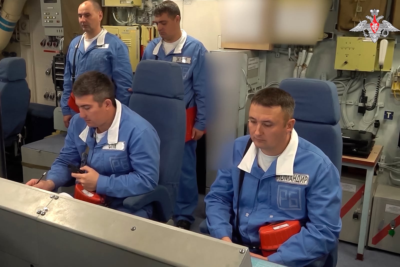 In this photo taken from video distributed by Russian Defense Ministry Press Service on Tuesday, Oct. 29, 2024, Crew of a Russian nuclear submarine prepare for a practice missile launch as part of drills of Russia's strategic nuclear forces. (Russian Defense Ministry Press Service via AP)