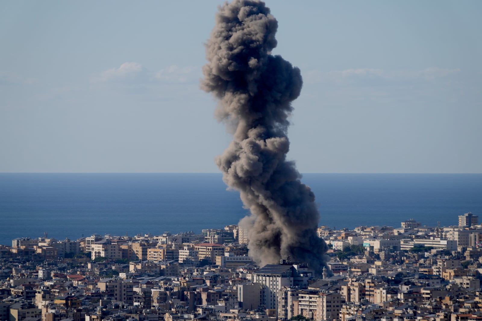 Smoke rises from an Israeli airstrike on Dahiyeh, in the southern suburb of Beirut, Lebanon, Saturday, Oct. 19, 2024. (AP Photo/Hussein Malla)